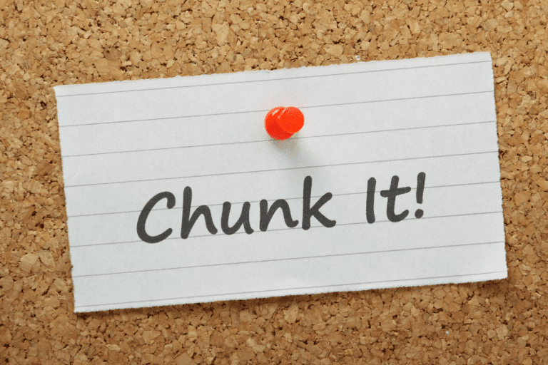 The phrase chunk it written on some paper pinned to a cork board