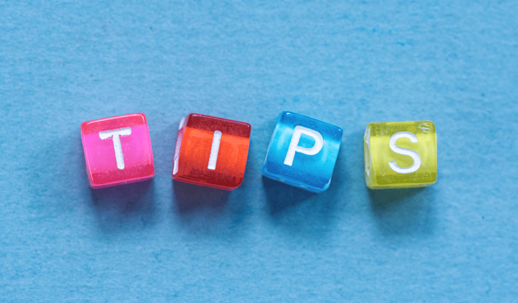 The word tips spelt out using coloured beads on a blue background.