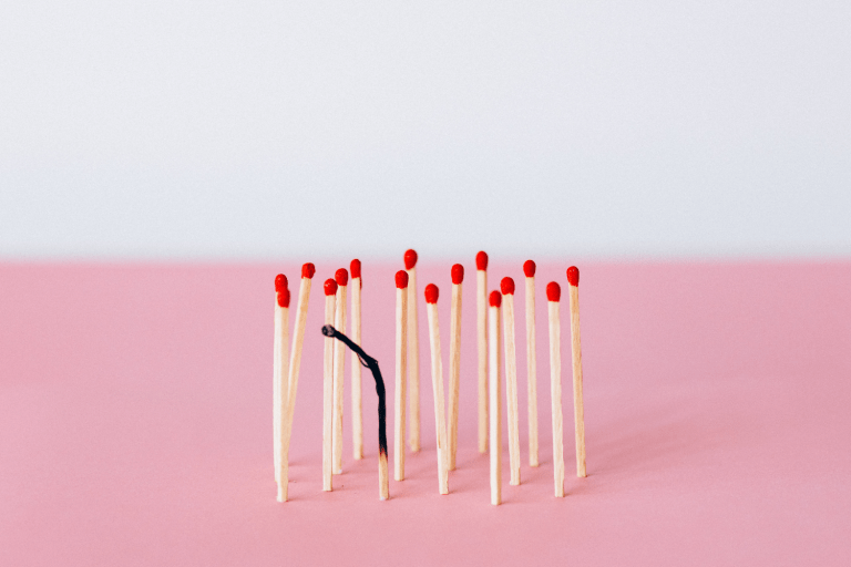 match sticks on a pink background.