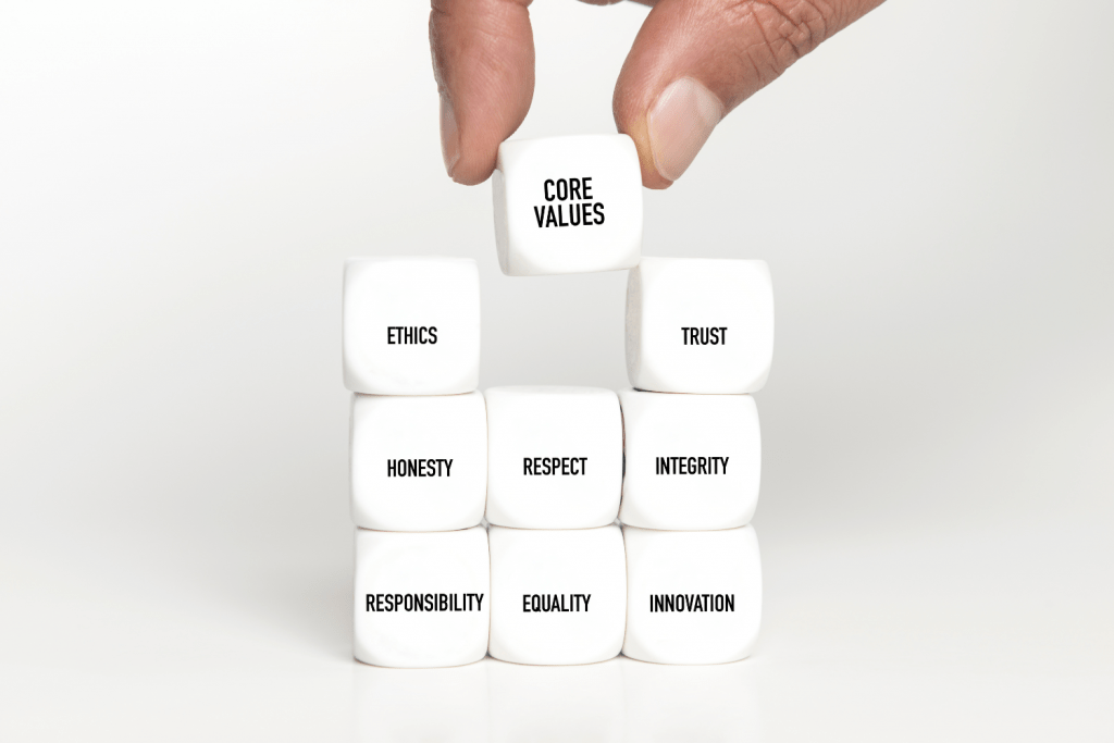 a hand is holding up a stack of dice with the word customer value on it.